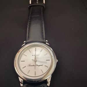 Relic stainless steel watch with black leather band.